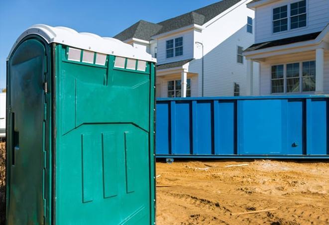 practical and convenient porta potties at a bustling construction site